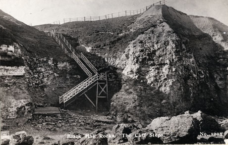 Postcard photograph, entitled Black Hall Rocks. The Cliff Steps., numbered 1205, showing, in close-up, the steps down the front of the cliffs at Blackhall