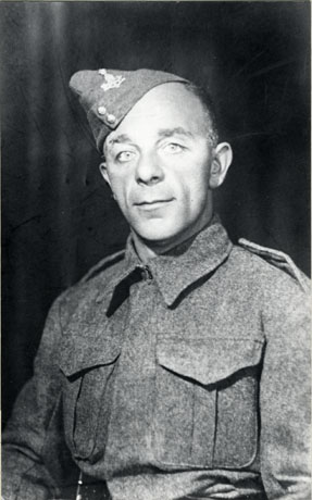 Photograph of the head and torso of Leo Pieroni, of Blackhall Rocks, in battle dress; indistinct insignia may be seen on his cap