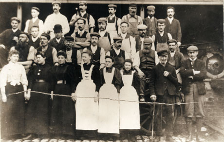 Photograph of a group of workers at Nimmo's Brewery, Castle Eden, including six women and twenty four men; they are photographed in a yard