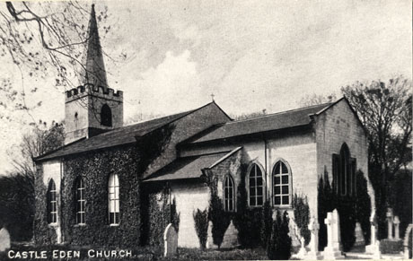 Postcard photograph entitled Castle Eden Church, showing the exterior taken from the north east, close to the walls of the church, and creepers on the walls and a number of gravestones