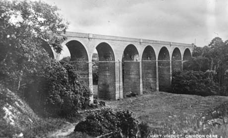 Postcard photograph entitled Hart Viaduct, Crimdon Dene, showing the seven arches of the viaduct with trees at either end