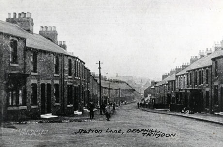 Postcard photograph entitled Station Lane, Deaf Hill, Trimdon showing Station Lane from the opposite end from that shown in deaf0016; a street of terraced houses can be seen with a number of indistinct figures on the pavements