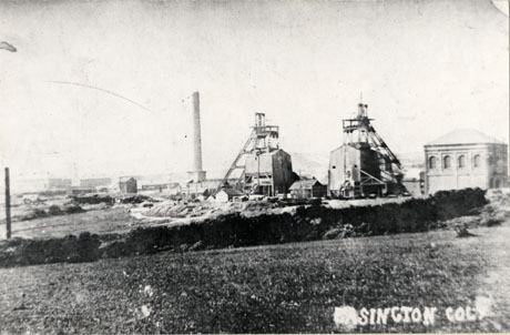 Postcard photograph entitled Easington Colliery, showing the winding gear, winding house, chimney and other buildings of the colliery