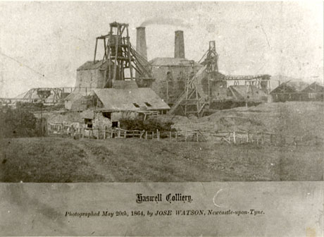 Photograph of the exterior of the buildings and winding gear of Haswell Colliery photographed by Jose Watson of Newcastle upon Tyne on 20 May 1864;the photograph appears to have been printed in a book