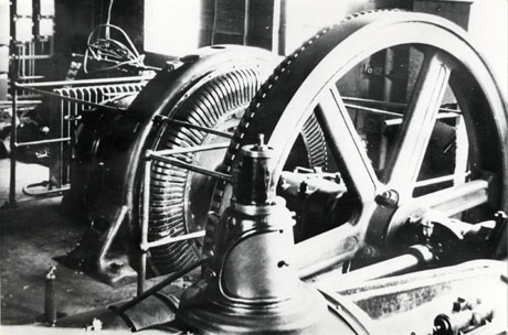 Photograph of large wheel and mechanism, part of the main engine, at The Northern Sabulite Explosives factory at Haswell in situ in the factory