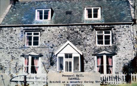 Photograph on which there is a typed note reading: Pesspool Hall, Haswell. Erected as a monastery during the 13th century, showing a house built of rough stone with two small bay windows and a small porch on the ground floor and two windows on the first floor; two dormer windows are in the roof This photograph was submitted by Philip Soakell from the album 'History of Haswell and District', which was compiled by his grandfather Fred Soakell.