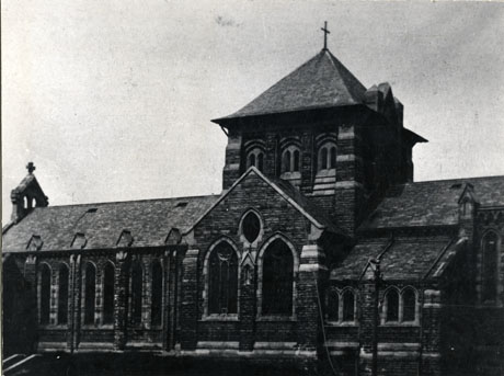 Photograph of the exterior of St. Mary's Church, Horden, showing the tower and the south side of the building, from close up