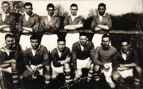 Photograph of a group of football players in their club strip, posed in front of trees; the photograph has been identified as Horden Juniors 1939