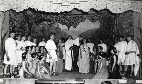 Photograph of thirty one members of the cast of Arcadians, in costume and grouped on stage in front of the scenery; the performers have been identified as members of the Horden and District Operatic Society