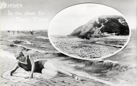 Postcard photograph entitled Horden is the Place for Happy Times, showing a woman lying on the sand near the waves, with an inset photograph of The Beach at Horden, looking across the beach towards the cliffs