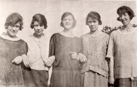Photograph, close-up, of five young women arm in arm; each has short hair and is wearing a straight dress or a blouse and skirt characteristic of the nineteen twenties; they have been identified as the Gould sisters: Hilda, Rita, Dora, Rhoda and Annie