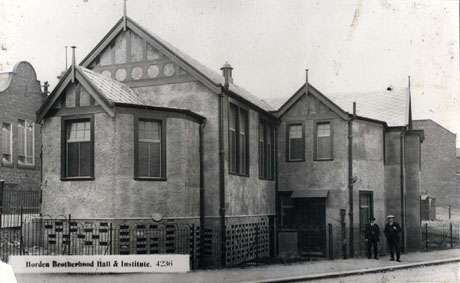 Postcard photograph entitled Horden Brotherhood Hall & Institute. 4236, showing the exterior of a stuccoed building of two storeys with false half timbering under its eaves; the view seen appears to be that of the rear of the building; two indistinct men can be seen on the pavement in front of the low railings surrounding the building