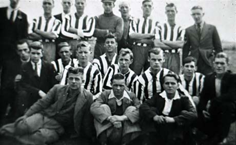 Photograph of twelve men in football strip, posed with ten other men in suits; they have been identified as Methodist Football Team, Horden