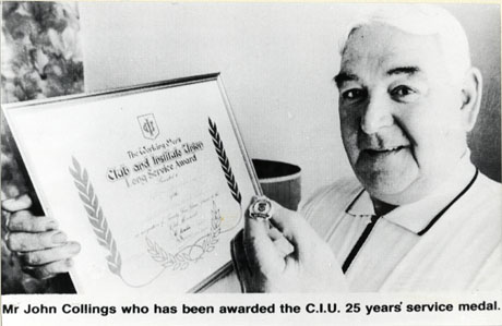 Photograph entitled Mr. John Collings who has been awarded the Club and Institute Union 25 years' service medal, showing a close-up portrait of the head and shoulders of an elderly man, holding a framed certificate and a small badge