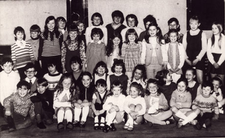 Photograph of thirty eight children aged approximately six to ten years posed inside a building; the photograph has been described as Road Safety 1970