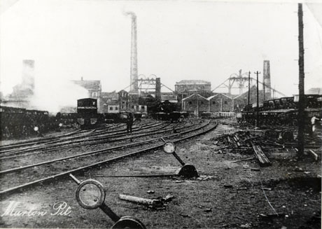 Postcard photograph entitled Murton Pit, showing what has been identified as the marshalling yard; in the foreground are railway tracks leading away from the camera towards the colliery buildings, including winding gear and two tall chimneys