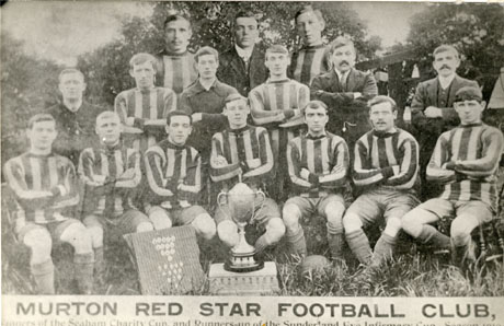 Photograph, captioned Murton Red Star Football Club; Winners of the Seaham Charity Cup and Runners Up of the Sunderland Eye Infirmary Cup Season 1910-1911, showing twelve men in football strip with four other men, photograph ed against a background of trees and grass; in front of the group are a trophy cup and a board with medals on it