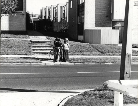 Photograph of the same view as that in pete0012, taken from slightly further away from the steps; the photograph has been described as Manor Way, Peterlee, 1976; a group of four children can be seen from the rear on the pavement in front of the steps