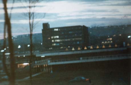 Photograph, taken at twilight, showing an indistinct image of an office block, which has been identified as Ridgemont House, Peterlee