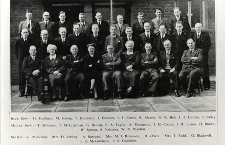 Photograph of a group of twenty five middle-aged men and three middle-aged women posed in front of a brick building; they have been identified as Local Labour Party Councillors, Seaham, as follows: Back Row: H. Faulkner; M. Strong; T. Brammer; J. Dawson; J. T. Curtis; R. Marrin: G. K. Bell; J. T. Curran; J. Bailey; Middle Row: T. Williams; T. McLauchlan; G. Brown; E. A. Taylor; A. Thompson; J. H. Coates; J. R. Coates; J. R. Lowes; H. Brown; W. Spence; A. Falconer; W. R. Peardon; Seated: G. Moreland; Mrs. D. Jobling; A. Burrows; Mrs. M. I. Robinson; H. Oliver; Mrs. T. Todd; O. Blackwell, J. E. McCutcheon; J. S. Goodwin