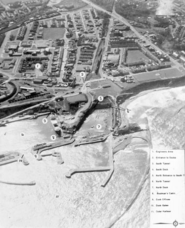 Photograph giving an aerial view of the harbour and area immediately around the harbour at Seaham, with a key identifying some of the buildings