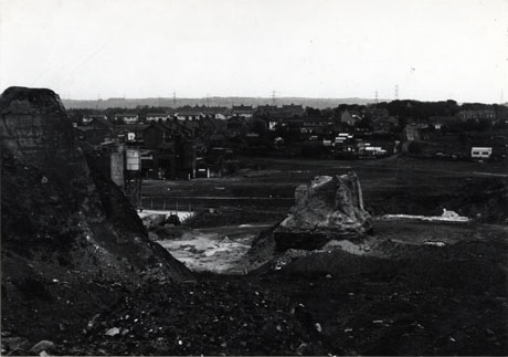 Photograph of Shotton taken from the pit heap which forms the foreground of the picture; the view is very similar to that in shot0002 with the open space immediately in front of it with the colliery buildings and houses beyond them