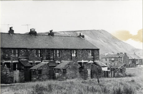 Photograph of the same view as in shot0027, 30, 31, but this photograph is taken further to the right of the houses and the buildings of the colliery can no longer be seen; instead, the side of the pit heap and groups of houses to the right beyond the terrace can now be seen; the colliery has been identified as Shotton Colliery