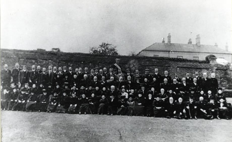 Photograph showing a group of approximately ninety five people posed in front of a bick wall surrounding the grounds of a large house identified as The Hall; many of them appear to be elderly and they are described as South Hetton R. A. O. B. Outing; this may be possibly interpreted as the Royal Ancient Order Of Buffaloes; the dress is that of the beginning of the twentieth century